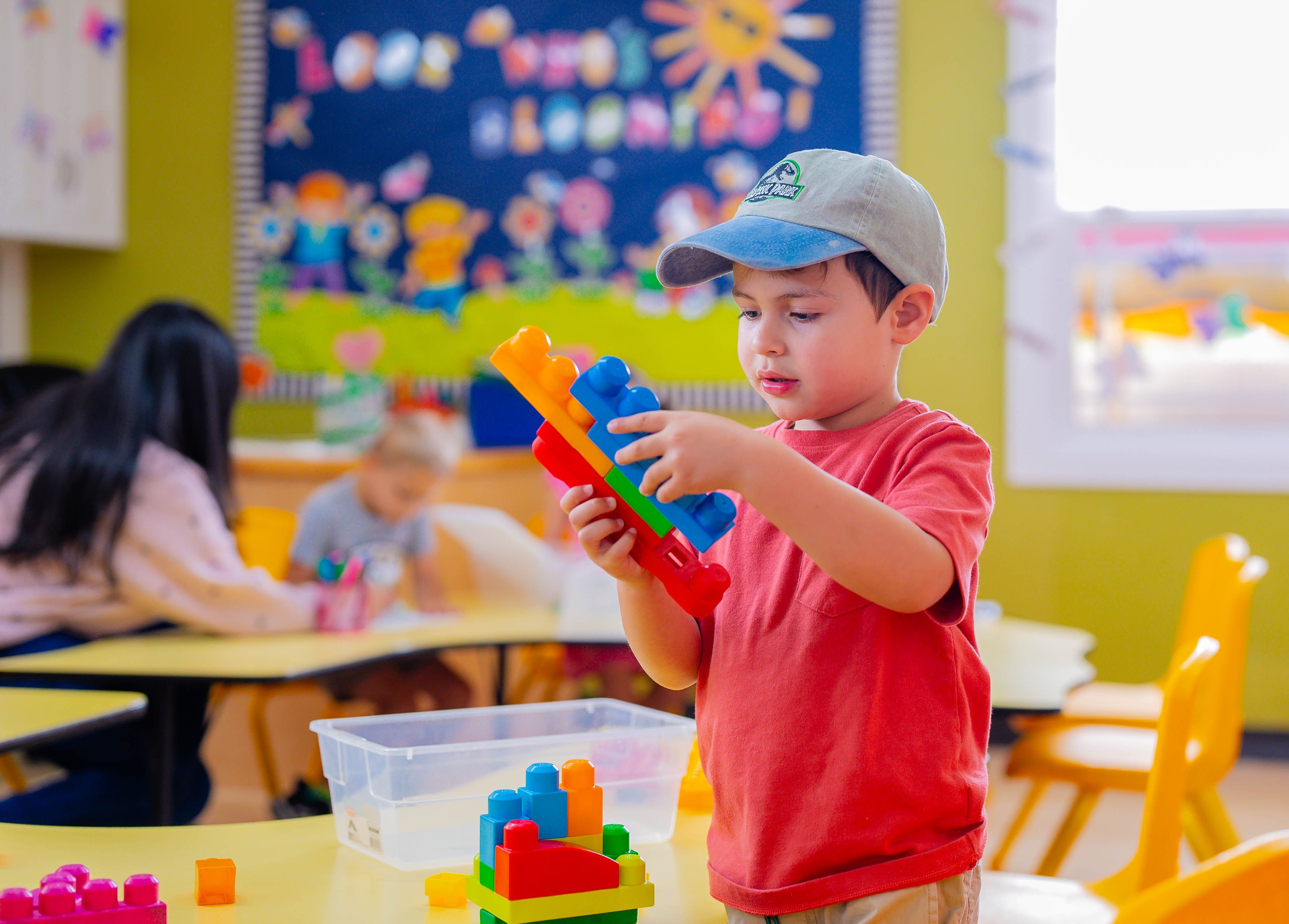 Engaged students exploring hands-on activities at preschool in Irvine