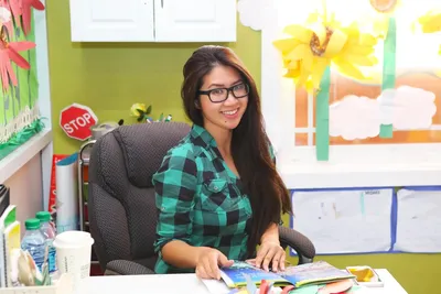 Newport Ave Preschool director available to communicate with parents about their child's day
